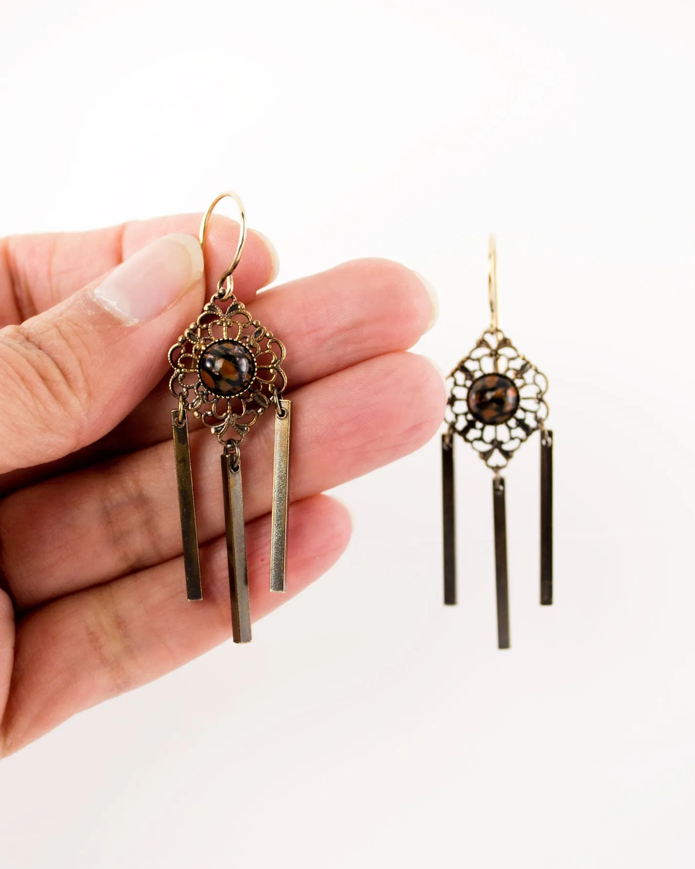 Delicate antique filigree dangles | orange black earrings