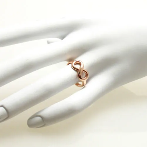 Graceful and Elegant Infinity Ring in Rose Gold Ion Plated Sterling Silver.
