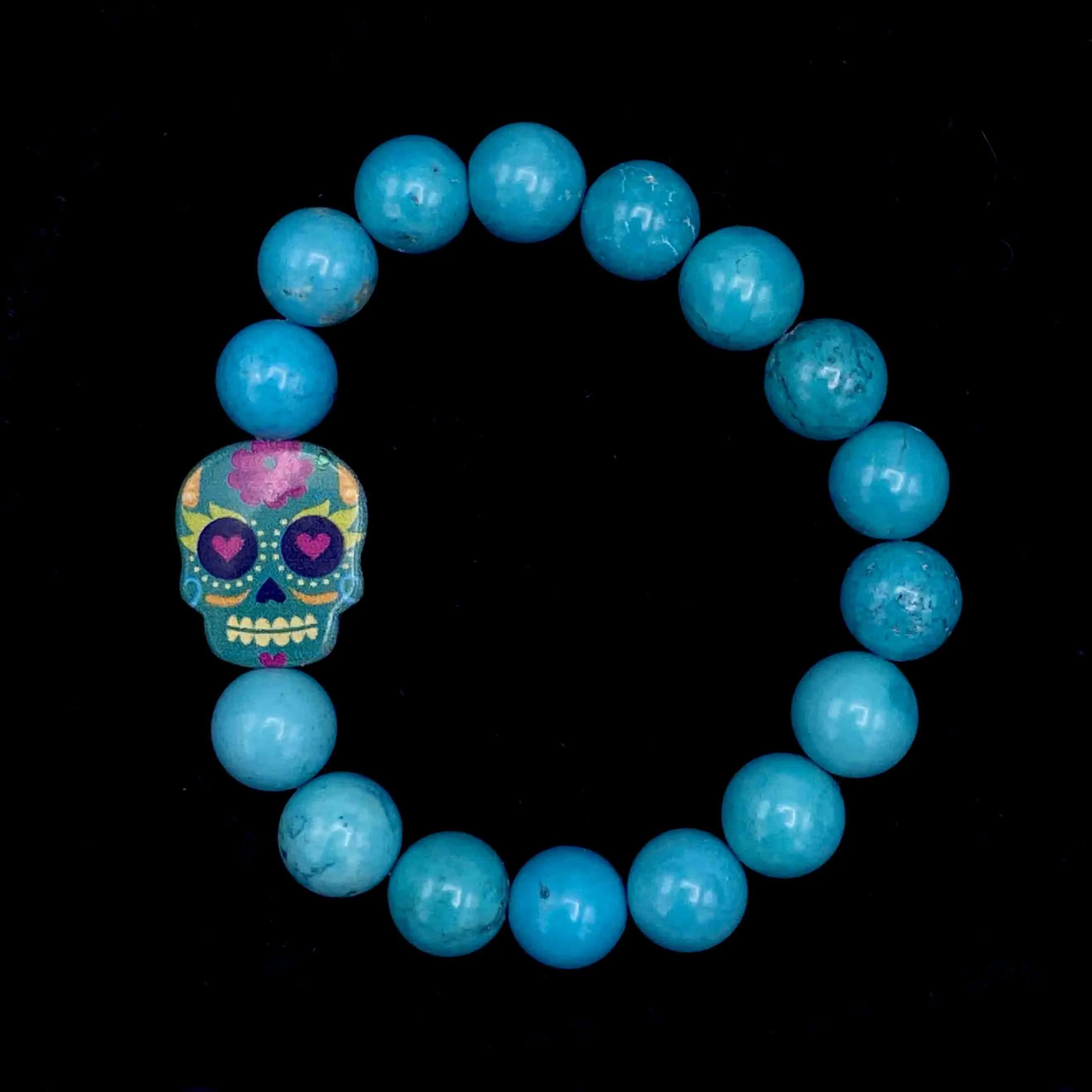 Metal Skull on gemstone beaded bracelet