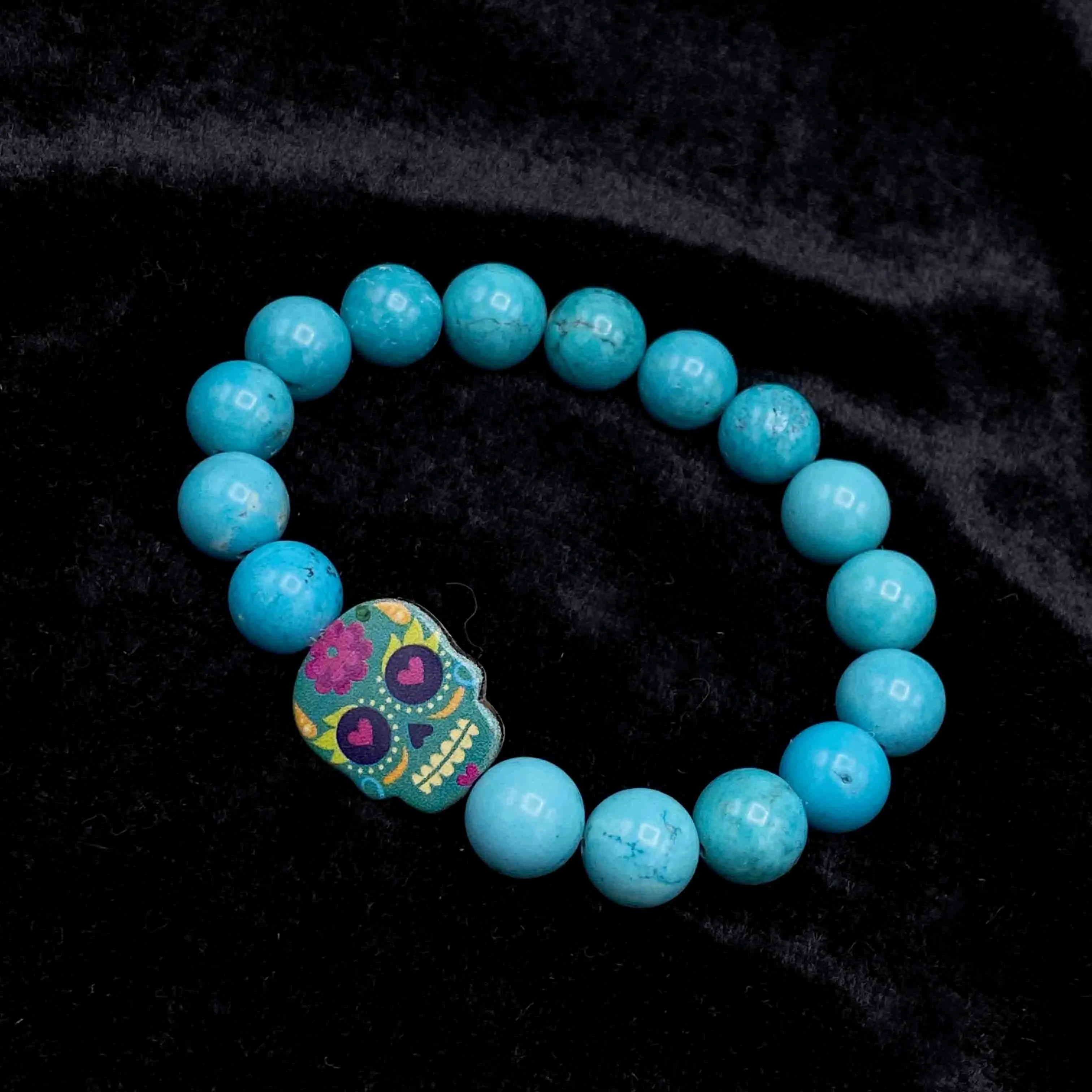 Metal Skull on gemstone beaded bracelet